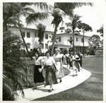 Students walking by Kelley House